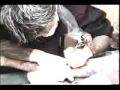 Hakuei getting tattooed