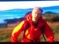 Nicholas Crane goes on a treck around scottish mountains. He nearly falls down a hill with his umbrella. Legend.