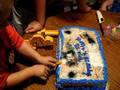Backhoe eating the birthday cake