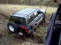 Jeep Cherokee running a shallow trench