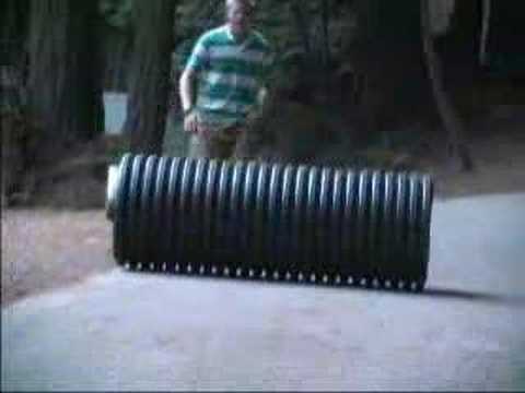 Guy Rolls Down a Hill and Cliff in a ...