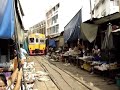 train market at a small town of samut songkram outside of bangkok, thailand. interesting transformation of space can be seen here