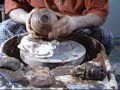 This is a video using B-3 brown slip to decorate bisque-ware.
