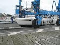Hoisting a boat from the harbour in St-Vaast-la-Hogue