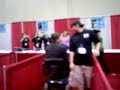 Nathan Fillion decided he needed to see the show floor at the FX Show 2008 in Orlando, FL on Sunday, January 27, 2008.  He didn't want to walk around, though.  One of the dealers lent him her power scooter, and, well, let's just say for a pilot he needs some training.