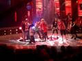 Bonny on Australian idol stage playing air guitar