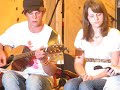 This is me at camp during a talent show. Me and a few friends decided to do something for it and we arranged this in a day haha. I'm the one in the white shirt and I'm also the one who does the harmony later on in the song. Joel is on the far left and Brad is on the far right. The other girl with me is Ashley.