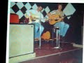 during the summer of 1977, after busking around europe i came home for something to eat and immediately ended up going on a two week tour of cornwall and the scilly isles with cappo - still needing something to eat.
sorry about the still photo, but its all i have, the song and the man is the special bit.  can anybody help me identify the pub?  i thought it was in perranporth, the 'green parrot' ???  it was run by a big blonde woman in a big black frock who frightened me shitless.  i asked her for  a gig and she said ' give me one good reason', -i couldn't get any words out. answers on a postcard please ! notice the 4x10's pa system!
we ended up in newquay at the lovely lovely dennis quixbys' place, who never put his teeth in and had a never ending bottle of brandy. god i was so sick! does anybody out there remember these people??
tony made 'punch and judy man' his own song with all respect to john connoly.  tony tortured me with his own brand of english folk song, and his unique interpretation of it, songs which have stuck in my brain all these years.
in the photo he is playing a 'tama' acoustic, god knows why he played this instead of his beloved martin d28.  i had my old gibson j45, and we would play 'goodnight irene' together and then strip off! what a show!
he always ingratiated himself with audiences and i remember a lovely crowd of german visitors being treated to storys of spitfires and lancasters. went down a bomb.
i have some other snippets of 'cappo' which i will soon put on but would love to hear from anyone else out there.  if theres anyone playing the banjo in heaven tonite , its cappo!