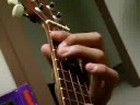 ukulele player (just watch it)