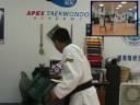 Apex Taekwondo breaking boards with the Bolder Board Holder by MA Toolz. Apex teaches both ITF and WTF styles of Taekwondo. Master Hong is featured on ITF and WTF Poomse DVDs.