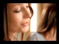 Beautiful Girl using a Cordless Hair Straightener