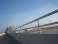 videos de Biking on the Santa Ana River Channel Bridge with a Paramotor over head.