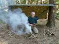 bushcraft survival tarp shelter with fire
