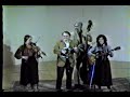 the tall timber band - vivian williams, fiddle; phil williams, mandolin; sue thompson, guitar; barney munger, bass, performing a medley of fiddle tunes - ferry bridge hornpipe, danny flannigan's clog, and rickett's hornpipe, at the seattle concert theater, 1981, recorded on betamax.  you can hear more music from these musicians on cds from voyager recordings, www.voyagerrecords.com