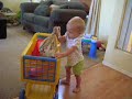 Adessa playing with her cart and pretend purse