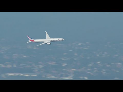 American Airlines Boeing 777-300ER flies over Sydney Harbour