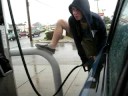 pumping gas in the rain