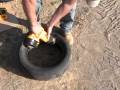 Earthship How To cut half tires for spacer block