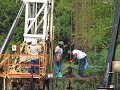 Workover Rig Crew Running Rods In Bryan Texas 2008