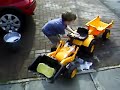 Andrew playing with his toy JCB Digger