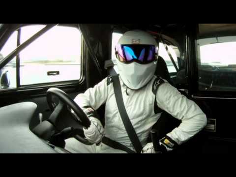 Top Gear Stig - The Stig takes a somewhat terrified Dan Trent for a ride in his special London taxi around the ExCeL centre in London, host for the 2011 Top Gear Live shows.