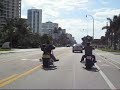 2 Big Dogs run in front of the Gold Wing GL1800