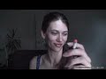 Brunette with hair in pony tail smoking cigarette Brunette with hair in pony tail smoking cigarette