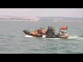 A Royal Navy bomb disposal team carried out the controlled explosion of a three-quarter-tonne Second World War mine on Thursday, 11 March 2010. The mine had been uncovered by dredgers in Portland Harbour, Dorset.