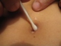 Cleaning my navel using a wet Q-Tip