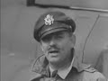 various shots of american film star captain clark gable at british base where he instructs usaf (united states air force) on gunnery. he shows how to handle a gun set on one of the american bombers. clark gable speaking to camera, telling of his job in the gunnery school (natural sound). some nice close up shots of clark gable in uniform.