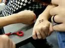 Brey getting a tatoo