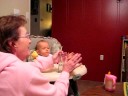 Hailey blowing bubbles into her water glass