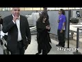 a pregnant kim kardashian and kourtney kardashian with her baby penelope walking through jfk airport today. kourtney stopped at a store to put the baby in th...