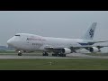 Boeing 747-200F wet runway take off close up - Manchester UK