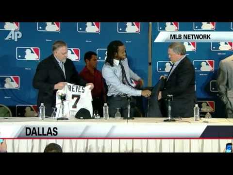reyes_presser - All-Star shortstop Jose Reyes put on a Miami Marlins hat and officially joined his new team Wednesday. The NL batting champion got a six-year contract worth ...