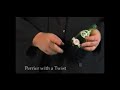 Perrier With a Twist by Kevin James This is a routine that Kevin developed in the trenches performing in restaurants and private parties for many years. It is a powerful multi-phase routine that is perfect for strolling environments. You begin by lighting a piece of paper and it visibly turns into a bottle that is handed out for examination. A 50 cent coin penetrates in and out of the bottle very cleanly and visually right through the glass. The magician explains that he can tell the secrets ...
