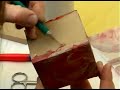 making a decoupage piggy bank : folding napkins inside a decoupage piggy bank