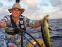 Mike catches a fish.
