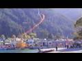 Hang glider looping landing approach over Queenstown