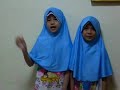 My two daughters reading the teacher's day message from me.