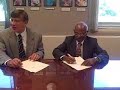 Dr. Thangaraju and VC John Owens sign MOU