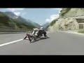 Jean Yves Blondeau riding down a mountain faster than some of the motorcycles.