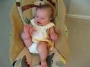 Gurgling Emily Playing with Feet in Bouncer
