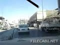Humvee Driving Through Traffic in Iraq.