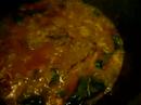 In this dutch oven, you can see gulasch being simmered hot for dinner, while outside snow falling coldly.