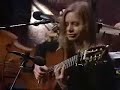 Incorporating banjo techniques, guitarist Muriel Anderson, with bassist and drummer, plays 
