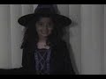 the little witch flying over on halloween