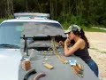 girl shooting a machine gun