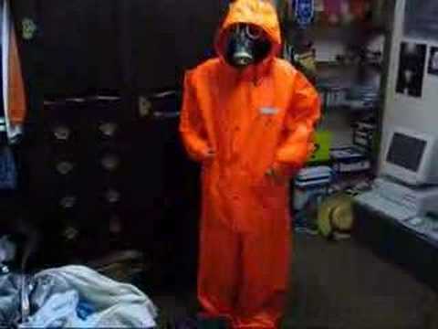 Rainweargirl - Wearing a heavy Ocean PVC overall and putting on a black russian gasmask.