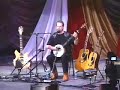 roger mcguinn playing willie moore with his banjo with a capo at the 3rd fret